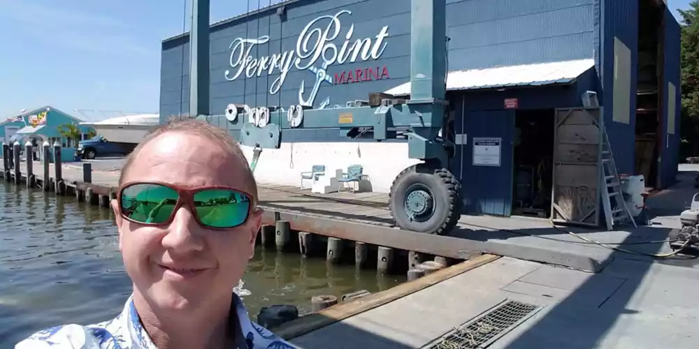 Jason Lee at Ferry Point Marina providing computer services.